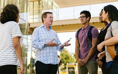 Dr. Townsend and students in front of Grimm Hall