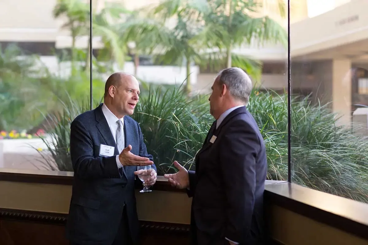 Two attendees having a conversation