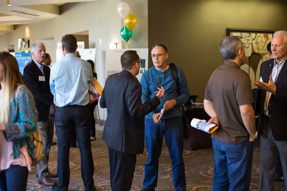 Attendees talking before the event